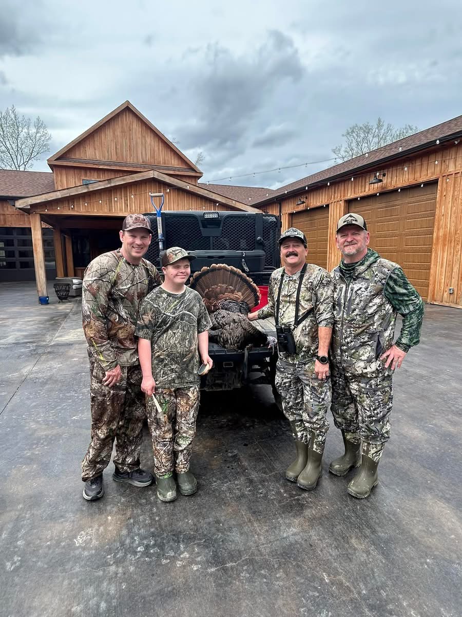Carson, his dad, Joe and Mark with the Tom.