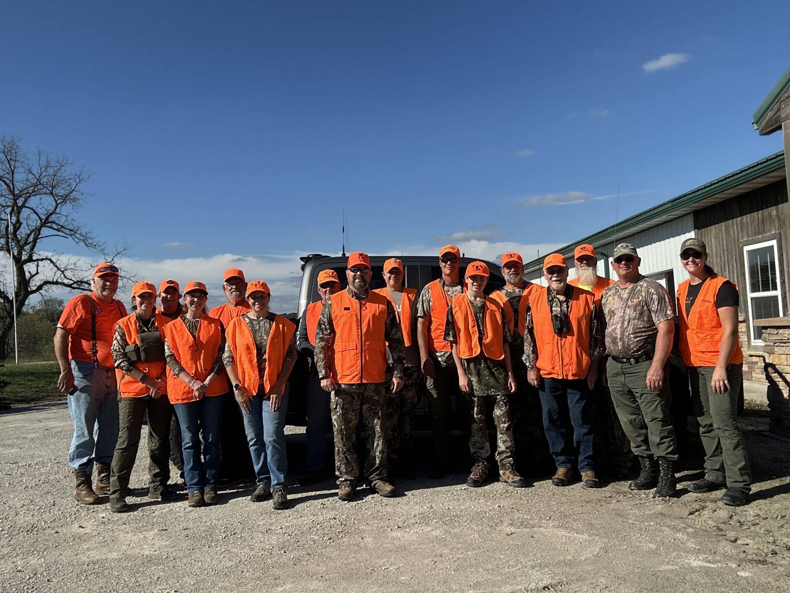 Group photo of hunters in camo ready for the deer hunt