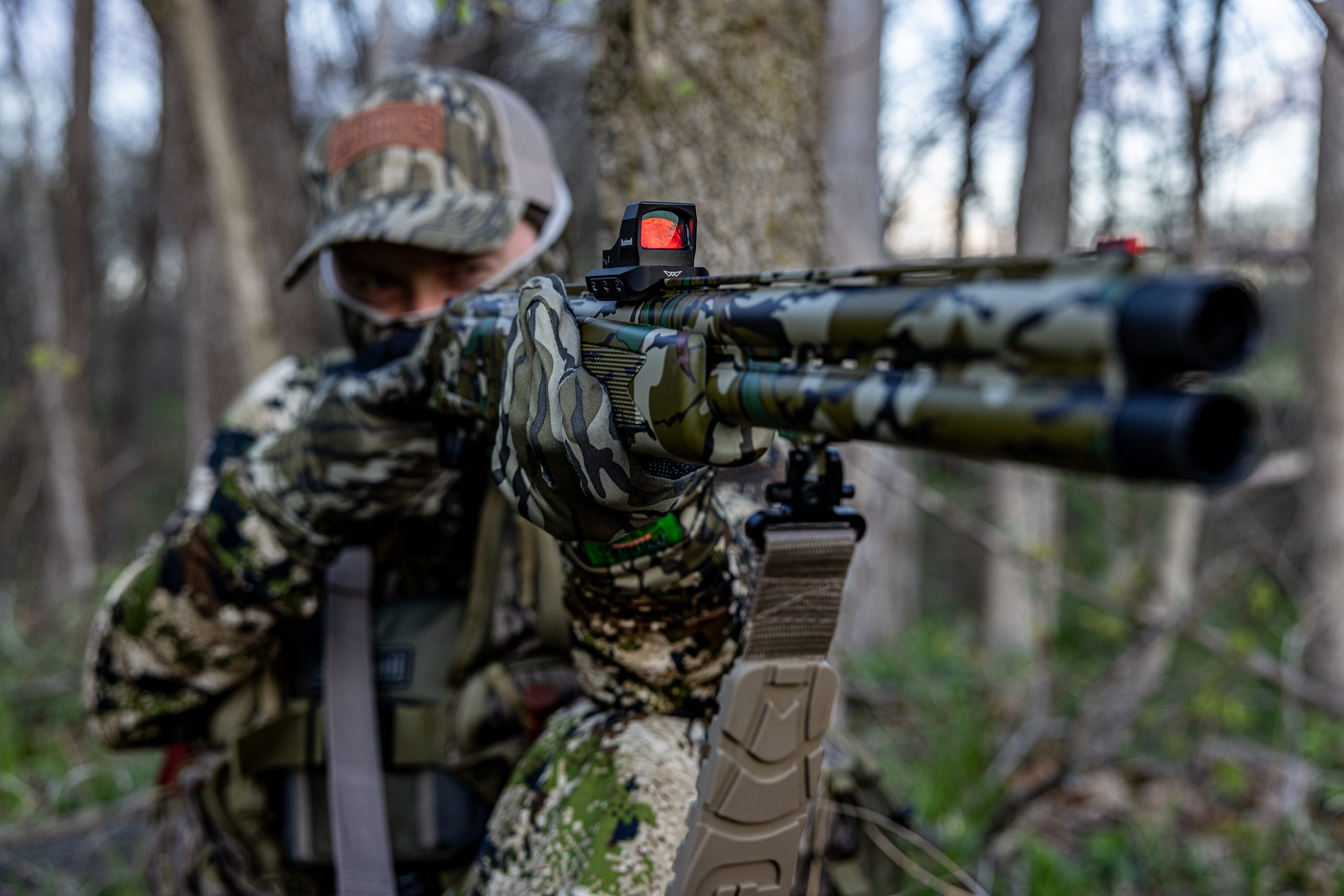 A turkey hunter takes aim.